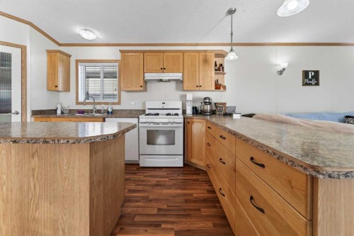 5004 Seasons Boulevard, Coaldale, AB - Indoor Photo Showing Kitchen With Double Sink