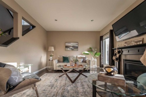 733 Twinriver Loop West, Lethbridge, AB - Indoor Photo Showing Living Room With Fireplace