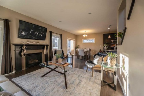 733 Twinriver Loop West, Lethbridge, AB - Indoor Photo Showing Living Room With Fireplace