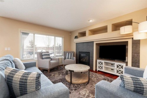 443 Everbrook Way Sw, Calgary, AB - Indoor Photo Showing Living Room With Fireplace