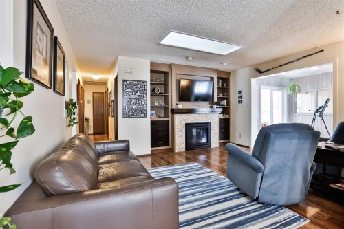 1813 Elm Road South, Lethbridge, AB - Indoor Photo Showing Living Room With Fireplace