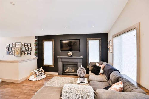 241 Sundance Drive, Coalhurst, AB - Indoor Photo Showing Living Room With Fireplace