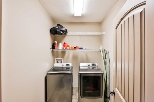 241 Sundance Drive, Coalhurst, AB - Indoor Photo Showing Laundry Room