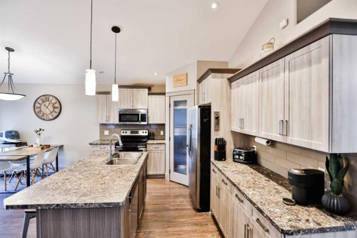 241 Sundance Drive, Coalhurst, AB - Indoor Photo Showing Kitchen With Stainless Steel Kitchen With Double Sink With Upgraded Kitchen
