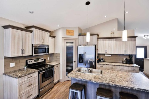 241 Sundance Drive, Coalhurst, AB - Indoor Photo Showing Kitchen With Stainless Steel Kitchen With Double Sink With Upgraded Kitchen