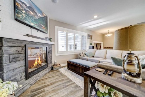 34 Honeysuckle Road North, Lethbridge, AB - Indoor Photo Showing Living Room With Fireplace