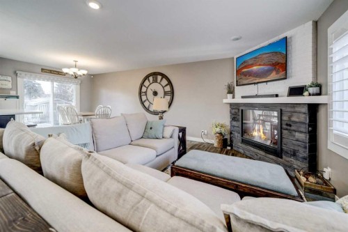 34 Honeysuckle Road North, Lethbridge, AB - Indoor Photo Showing Living Room With Fireplace
