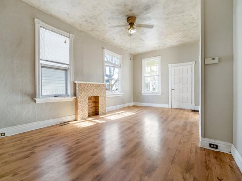1249 5A Avenue South, Lethbridge, AB - Indoor Photo Showing Other Room With Fireplace