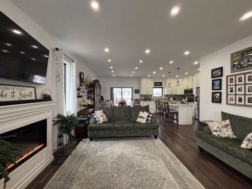 349 E 1 Avenue North, Magrath, AB - Indoor Photo Showing Living Room With Fireplace