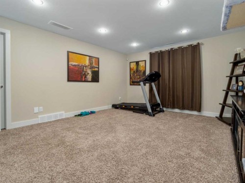 18 Northlander Road West, Lethbridge, AB - Indoor Photo Showing Gym Room