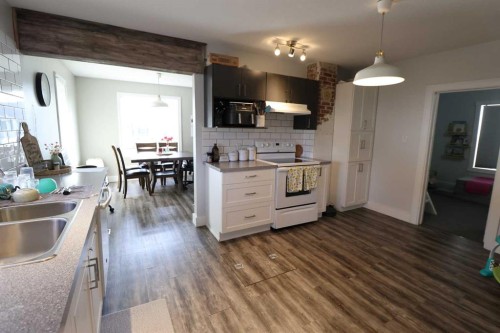 5009 41 Ave, Taber, AB - Indoor Photo Showing Kitchen With Double Sink