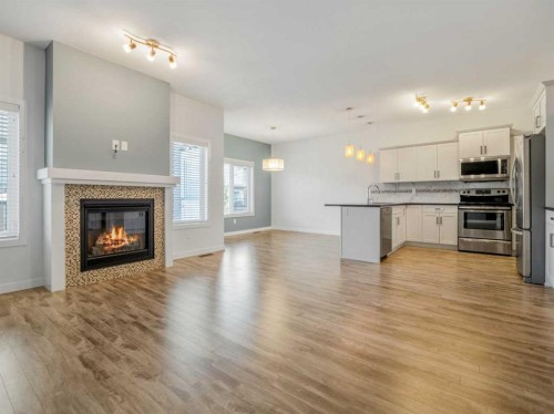 98 Moonlight Boulevard West, Lethbridge, AB - Indoor With Fireplace