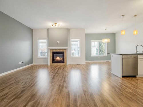 98 Moonlight Boulevard West, Lethbridge, AB - Indoor Photo Showing Living Room With Fireplace