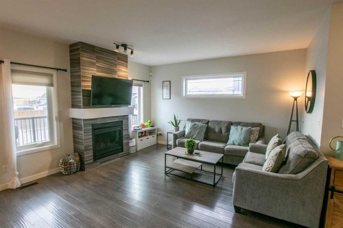 128 Cabot Landing West, Lethbridge, AB - Indoor Photo Showing Living Room With Fireplace