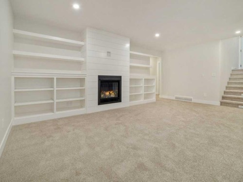 4517 40 Avenue South, Lethbridge, AB - Indoor Photo Showing Other Room With Fireplace