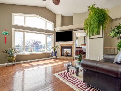 314 Coulee Springs Terrace, Lethbridge, AB - Indoor Photo Showing Living Room With Fireplace