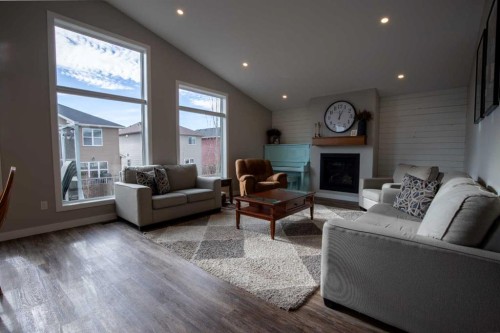 340 Greenwood Place, Coalhurst, AB - Indoor Photo Showing Living Room With Fireplace