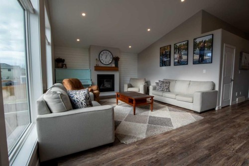 340 Greenwood Place, Coalhurst, AB - Indoor Photo Showing Living Room With Fireplace