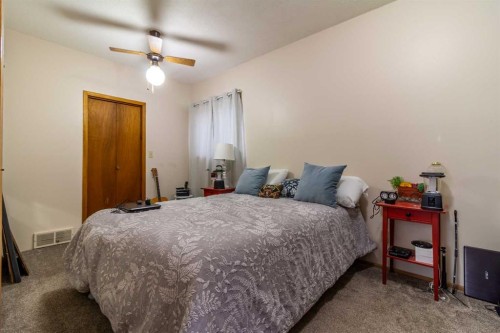 253 51 Avenue E, Claresholm, AB - Indoor Photo Showing Bedroom