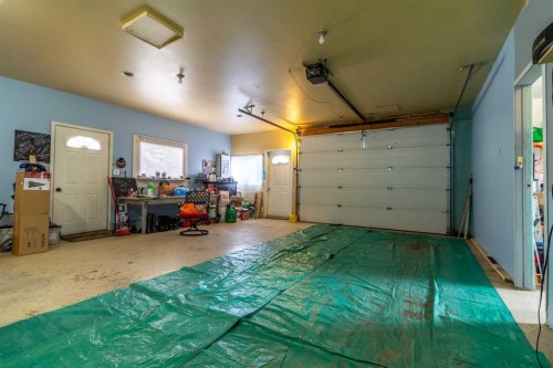 253 51 Avenue E, Claresholm, AB - Indoor Photo Showing Garage