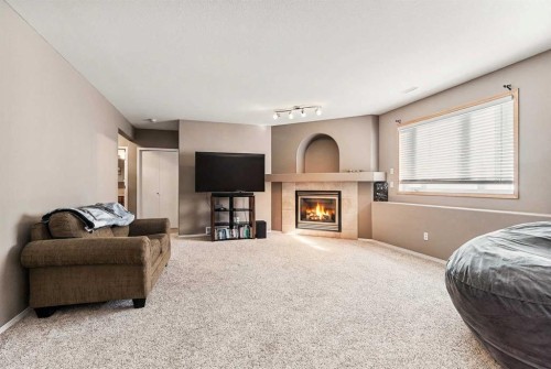 86 Salish Place West, Lethbridge, AB - Indoor Photo Showing Living Room With Fireplace