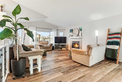 86 Salish Place West, Lethbridge, AB - Indoor Photo Showing Living Room With Fireplace