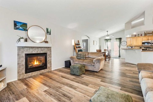 86 Salish Place West, Lethbridge, AB - Indoor Photo Showing Living Room With Fireplace