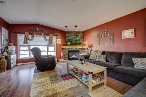 1414 84 Th Street, Coleman, AB - Indoor Photo Showing Living Room With Fireplace