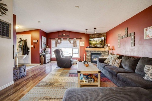 1414 84 Th Street, Coleman, AB - Indoor Photo Showing Living Room With Fireplace