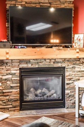 1414 84 Th Street, Coleman, AB - Indoor Photo Showing Living Room With Fireplace