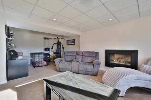 1413 20 Avenue North, Lethbridge, AB - Indoor Photo Showing Living Room With Fireplace