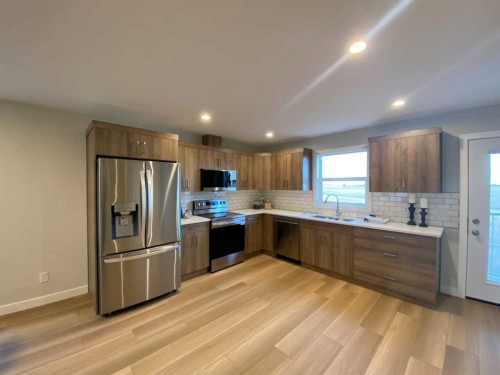 4213 57 Street, Taber, AB - Indoor Photo Showing Kitchen With Stainless Steel Kitchen With Double Sink