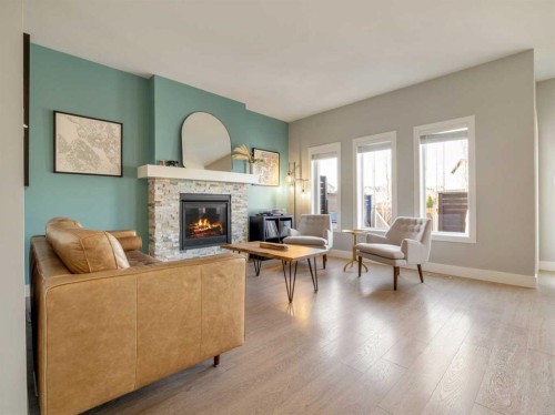 166 Crocus Terrace West, Lethbridge, AB - Indoor Photo Showing Living Room With Fireplace