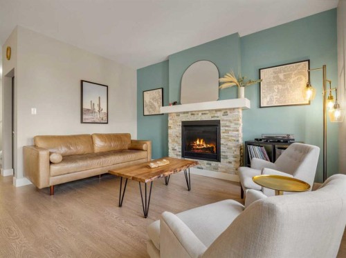 166 Crocus Terrace West, Lethbridge, AB - Indoor Photo Showing Living Room With Fireplace