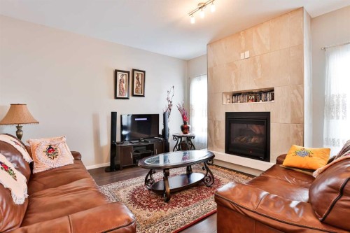 405 Moonlight Way West, Lethbridge, AB - Indoor Photo Showing Living Room With Fireplace