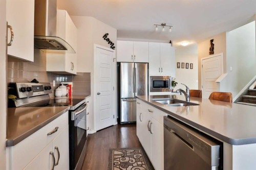 405 Moonlight Way West, Lethbridge, AB - Indoor Photo Showing Kitchen With Double Sink With Upgraded Kitchen
