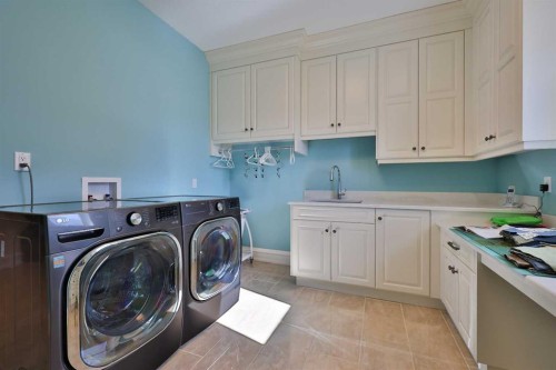 28 Cobblestone Lane, Raymond, AB - Indoor Photo Showing Laundry Room