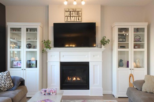 711 Moonlight Crescent West, Lethbridge, AB - Indoor Photo Showing Living Room With Fireplace