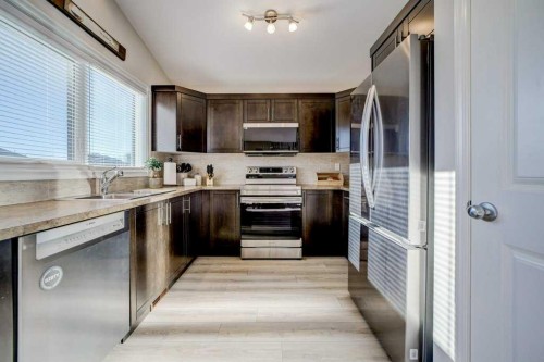 248 Sunridge Road West, Lethbridge, AB - Indoor Photo Showing Kitchen With Double Sink