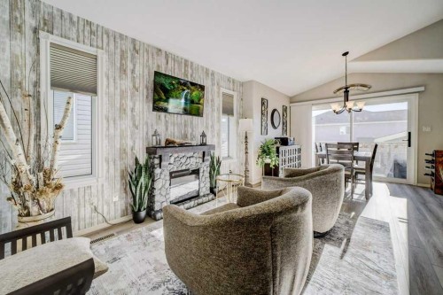 248 Sunridge Road West, Lethbridge, AB - Indoor Photo Showing Living Room With Fireplace
