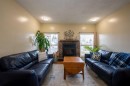 139 Laval Boulevard West, Lethbridge, AB  - Indoor Photo Showing Living Room With Fireplace 
