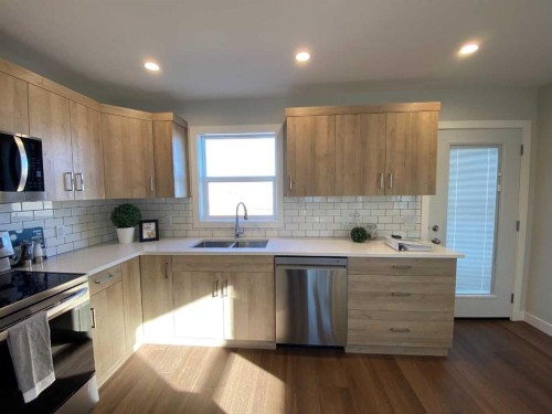 4209 57 Street, Taber, AB - Indoor Photo Showing Kitchen With Stainless Steel Kitchen With Double Sink