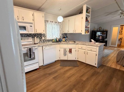 5403 42 Avenue South, Taber, AB - Indoor Photo Showing Kitchen With Double Sink