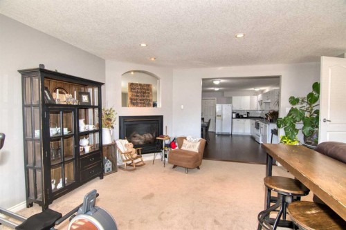 325 Canyon Boulevard West, Lethbridge, AB - Indoor Photo Showing Living Room With Fireplace