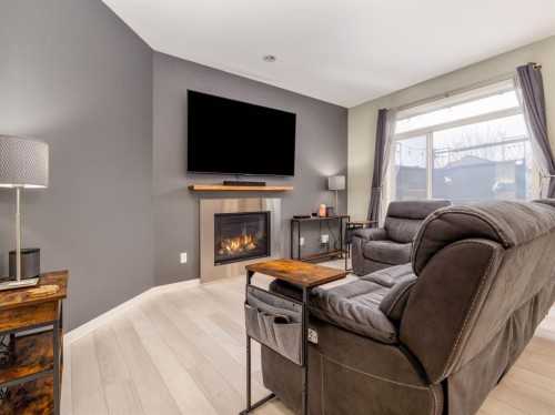 327 Mildred Dobbs Boulevard North, Lethbridge, AB - Indoor Photo Showing Living Room With Fireplace