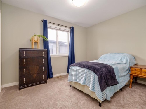 327 Mildred Dobbs Boulevard North, Lethbridge, AB - Indoor Photo Showing Bedroom