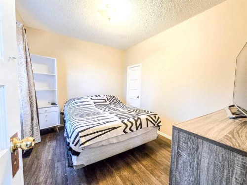 7070 18 Avenue, Coleman, AB - Indoor Photo Showing Bedroom