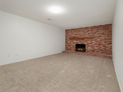 233 8 Street West, Cardston, AB - Indoor With Fireplace