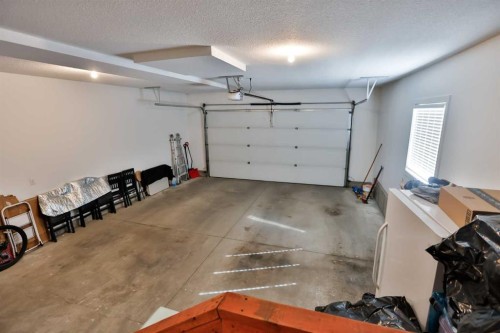 21 Riverford Close West, Lethbridge, AB - Indoor Photo Showing Garage
