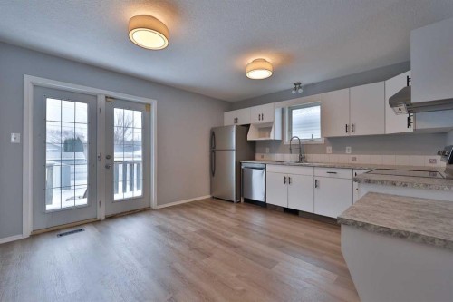2123B 20A Avenue, Coaldale, AB - Indoor Photo Showing Kitchen With Double Sink